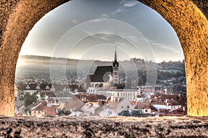 Central church of Cesky Krumlov as seen through a window