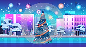 central city square with decorated christmas tree and fireworks in night sky happy new year winter holidays celebration