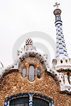 The central entrance to The Park Guell in Barcelona. Gingerbread houses. Right house, close-up of roof and tower.