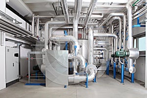 Central heating and cooling system control in a boiler room