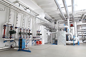 Central heating and cooling system control in a boiler room photo