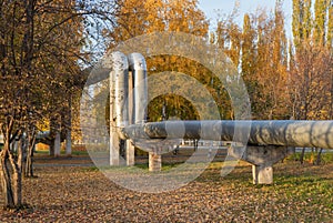 Central heating pipe in the city running through the Park. Russia