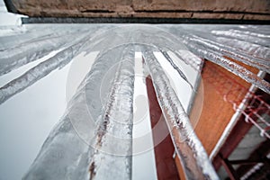 Central Heating and Power Plant with smoke industrial chimney  and icicles on the roof