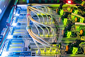 Central hosting platform of powerful computer equipment. The back panel of modern web servers is a close up. The network wires