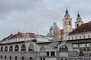 Central Market of Ljubljana, with the Ljubljanica river on foreground and the Ljubljana Cathedral in the background