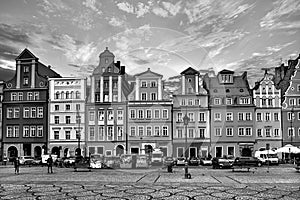 Central market square in Wroclaw Poland with old houses, street lamp and walking tourists people