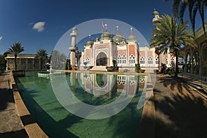 Central Mosque of Pattani with reflection and bright blue sky Southern Thailand.