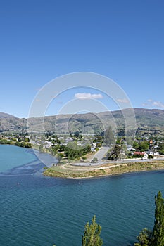 Central Otago town of Cromwell on bend in turquoise  Clutha River in Central Otago New Zealand