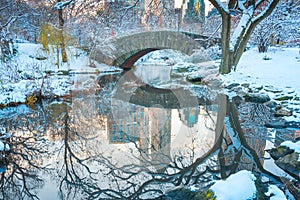 Central Park. New York. USA in winter covered with snow. Gapstow bridge. photo