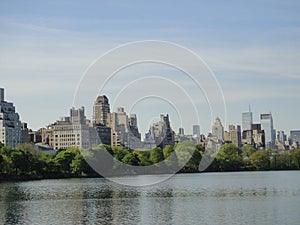 Central Park reservoir Upper West Side skyline blue sky Manhattan New York City USA