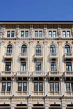 Central part of the facade, with statues, an important building in Trieste in Friuli Venezia Giulia (Italy)