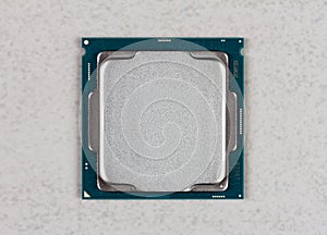 Central processor CPU on grey background closeup top view