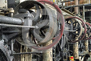 Central shaft driven by belt in old colonial factory, Java, Indonesia