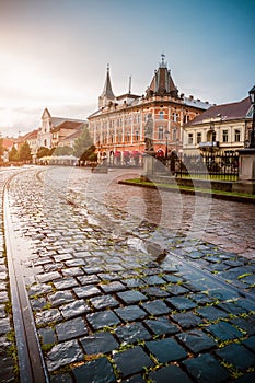 Central square in Kosice with tram rails after rain