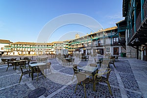 Central square of the town of Chinchon in Madrid, typical houses with wooden balconies and an old medieval atmosphere