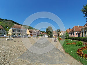 The central square and traditional old houses in Biertan - a touristic village from Transylvania, Romania