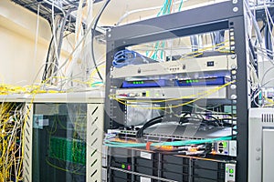 The central technical site of the Internet provider. Computer equipment installed in the rack of the server room. Several cabinets