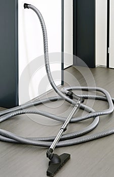 Central vacuum cleaner hose in living room