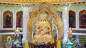 The Centre of Buddhism in Sanya. Temple with Lotus on the ceiling, Golden Buddha and many statues and goddesses.