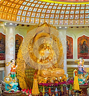 The Centre of Buddhism in Sanya. Temple with Lotus on the ceiling, Golden Buddha and many statues and goddesses.