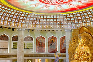 The Centre of Buddhism in Sanya. Temple with Lotus on the ceiling, Golden Buddha and many statues and goddesses.