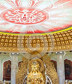 The Centre of Buddhism in Sanya. Temple with Lotus on the ceiling, Golden Buddha and many statues and goddesses.