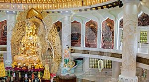 The Centre of Buddhism in Sanya. Temple with Lotus on the ceiling, Golden Buddha and many statues and goddesses.