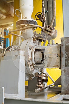 Centrifugal liquid transfer pump at oil and gas processing platform. photo