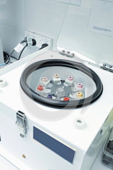 Centrifuge with pathology blood tubes for spinning photo