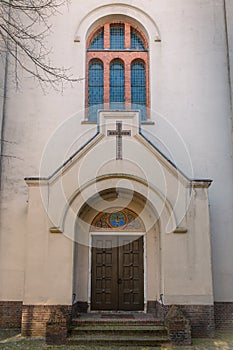 A centuries-old church door and arched church window