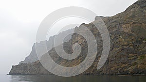 Centuries-old coastal cliffs on a cloudy day