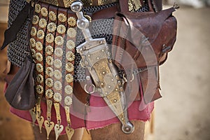 Centurion girding a pugio, a dagger used by roman soldiers as a sidearm