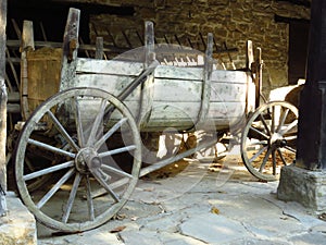 Century old Bulgarian wagon made of wood. Old obsolete transportation vehicle.