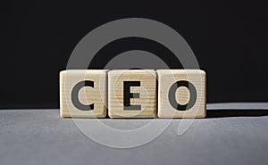 CEO - hief executive officer symbol. Concept word CEO on wooden cubes. Beautiful grey background. Business and CEO concept. Copy