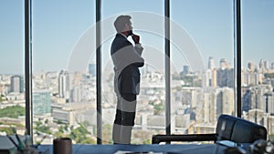 Ceo silhouette thinking future career at cityscape view. Pensive man in suit
