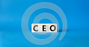 CEO symbol. Concept word CEO on wooden cubes. Beautiful blue background. Business and CEO concept. Copy space