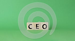 CEO symbol. Concept word CEO on wooden cubes. Beautiful green background. Business and CEO concept. Copy space