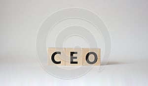 CEO symbol. Concept word CEO on wooden cubes. Beautiful white background. Business and CEO concept. Copy space
