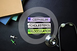 Cephalin Cholesterol Flocculation text on Sticky Notes. Top view isolated on black background. Healthcare/Medical concept photo