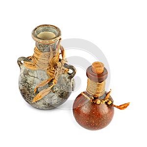 Ceramic amphora and bottle isolated on white background