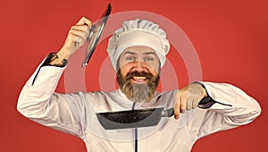 Ceramic applied pan. Preparing food in kitchen. Cooking food concept. High quality frying pan. Bearded man cook white