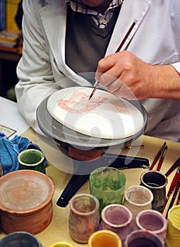 Ceramic artist working, pottery workshop