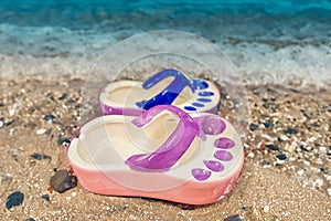 Ceramic ashtray in the shape of a flip flop by the sea. Tourism.Vacation Concept
