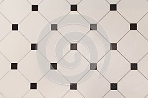 Ceramic beige octagon with tessellation black tiles background