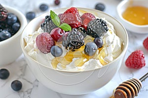 A ceramic bowl filled with thick Greek yogurt, topped with fresh berries and drizzled with golden honey, A bowl of Greek yogurt