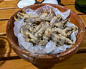 Ceramic bowl with fried fish