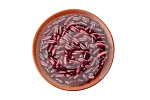 Ceramic bowl of raw red beans on white