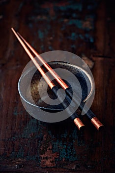 Ceramic bowl and wooden chopsticks