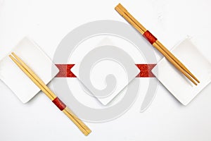 Ceramic bowls and bamboo chopsticks for sushi food