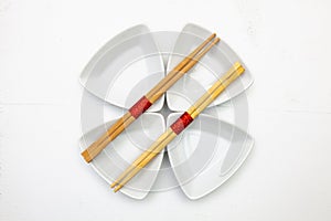 Ceramic bowls and bamboo chopsticks for sushi food